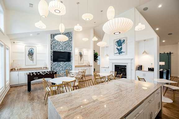 A modern kitchen with a marble backsplash and a fireplace at The Vista Apartments & Townhomes, South Carolina, 29851