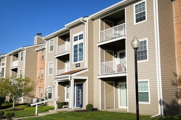 an apartment building with balconies and a street light at Steeplechase Apartments, Loveland, 45140