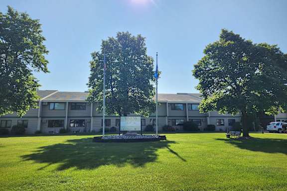A building with a flagpole in front of it.