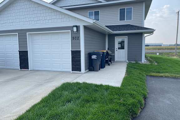 a house with mailboxes in front of it