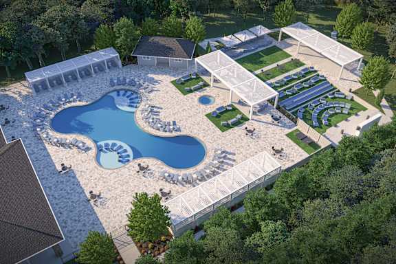 an aerial view of a resort pool with a poolside party area and a hotel at The Azul Apartment Homes, Mississippi