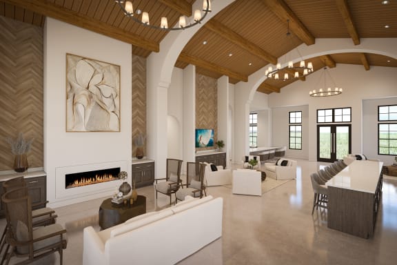 a large living room with a fireplace and a table and chairs at Saltaire Apartment Homes in FL 32459