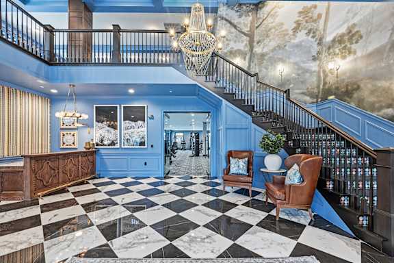 A large foyer with a black and white checkered floor. at Maison Apartments, Westerville