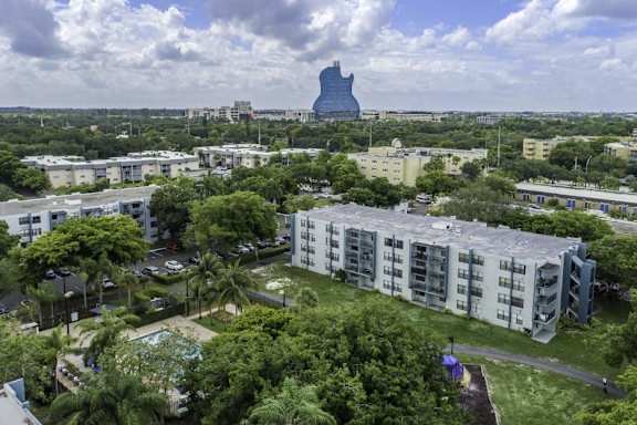 an aerial view of a city with a large building in the background at Club at Emerald Waters, Hollywood, Florida