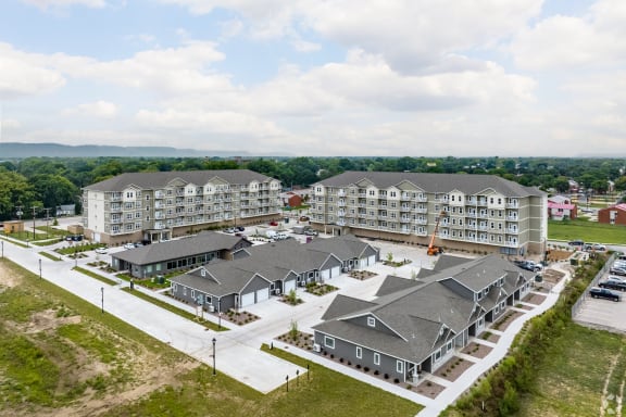 an aerial view of a group of apartment buildings in a city