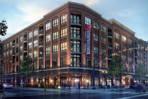 a rendering of a large brick building with a red sign that says rockwell automation