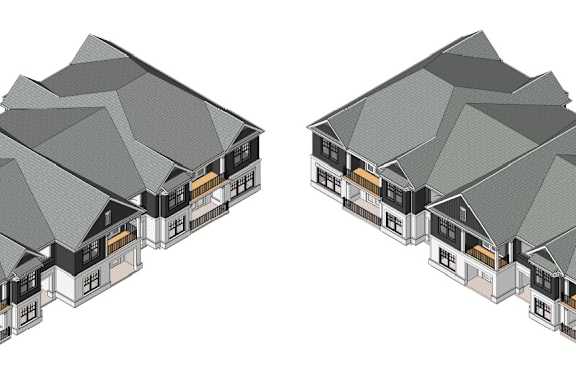Two identical houses with grey roofs and white walls.