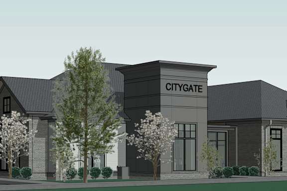 A rendering of a modern building with the words "CITYGATE" on the front.