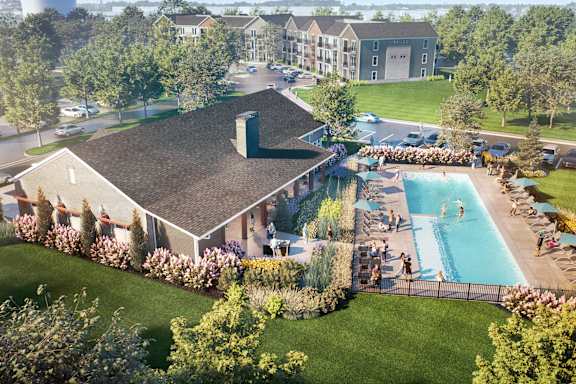 A large building with a pool in front of it.