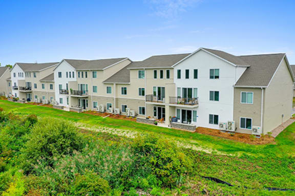 a row of houses on a green field