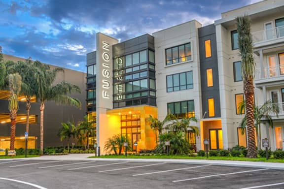 a large building with palm trees in front of it  at Fusion, Jacksonville, FL