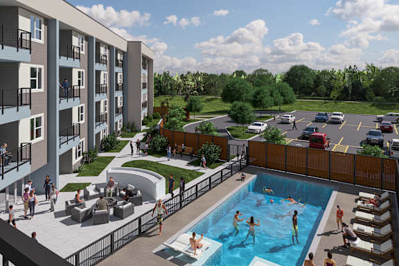 A group of people are gathered around a swimming pool.
