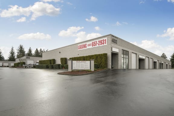 Red Soils Business Park in Oregon City, Oregon, exterior building, directional sign, and parking lot