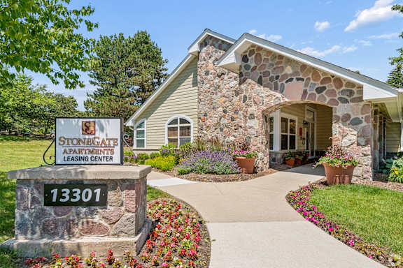 Stone building with a sign that says StoneGate Apartments.