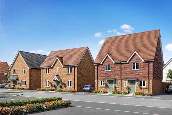 a row of houses in a housing estate with a parking lot