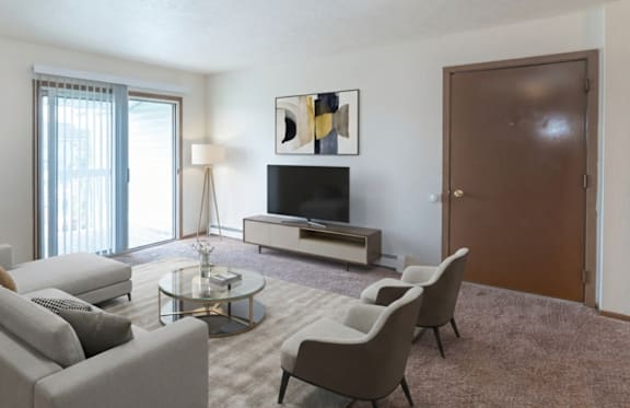 A living room with a couch, chair, and coffee table.