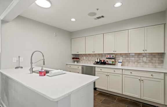 a kitchen with a counter top next to a stove top oven at Sterling Manor, Virginia