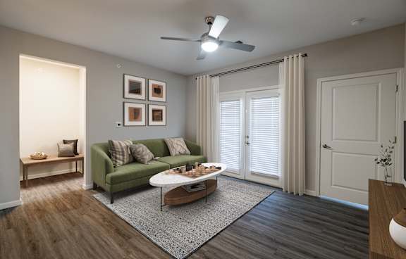 A living room with a green couch and a coffee table.