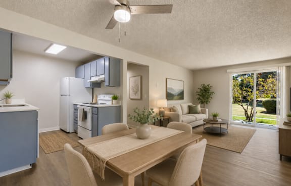 A modern kitchen with a dining table and chairs.