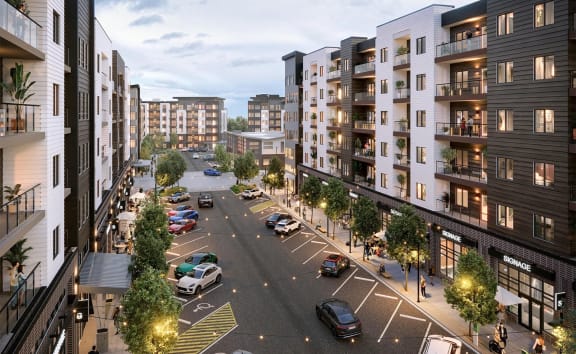 a rendering of a city street with apartments and cars on it