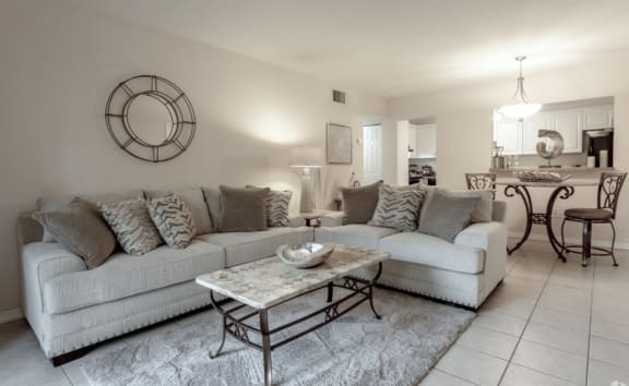 a living room with couches and a coffee table