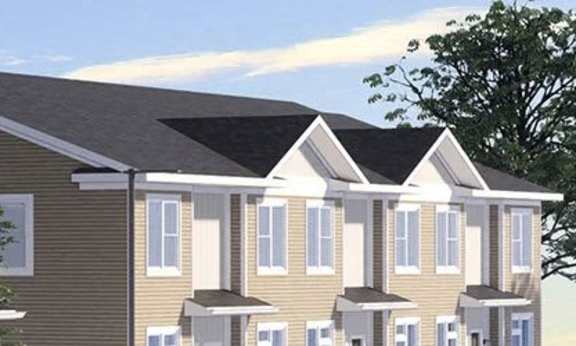 A row of houses with similar design and color.