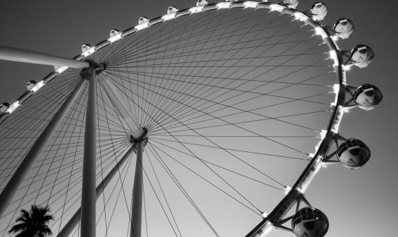 a black and white photo of a ferris wheel