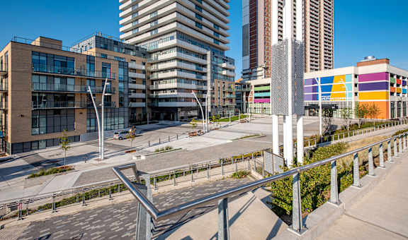 A modern cityscape with a mix of residential and commercial buildings.