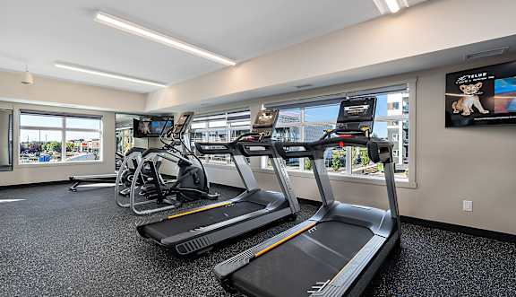 A gym with treadmills and exercise bikes.at The Fifth at Palisades, Edmonton, AB, T6V 0N5