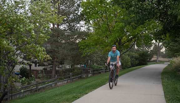 A man riding a bike on a paved trail.at The Countryside, Illinois, 60525