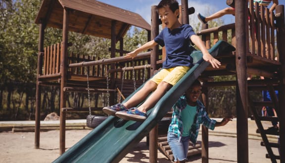 Lifestyle photo of children playing at playground