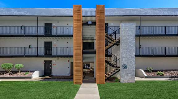 A modern building with a wooden column in front.