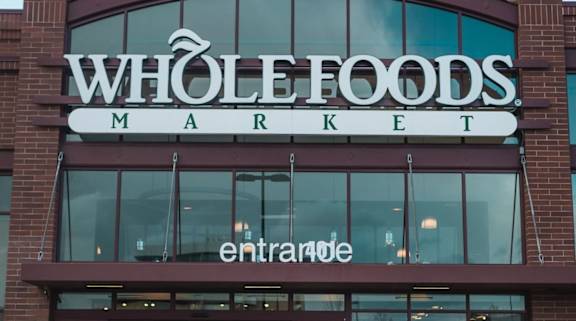 The entrance to a Whole Foods Market is shown.