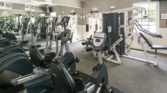 a room filled with lots of different types of exercise equipment