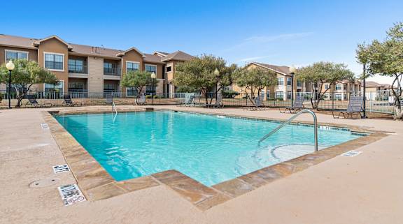 the swimming pool at the preserve at polo ridge apartments