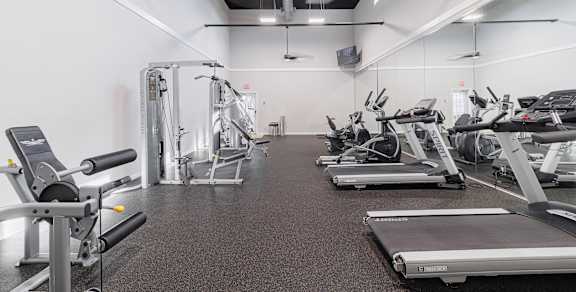 the gym at the enclave at woodbridge apartments in sugar land, tx
