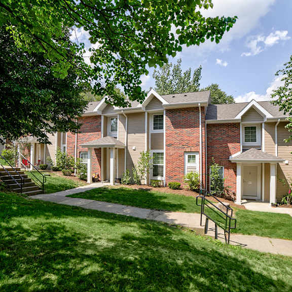 exterior building brick townhomes with sidewalk