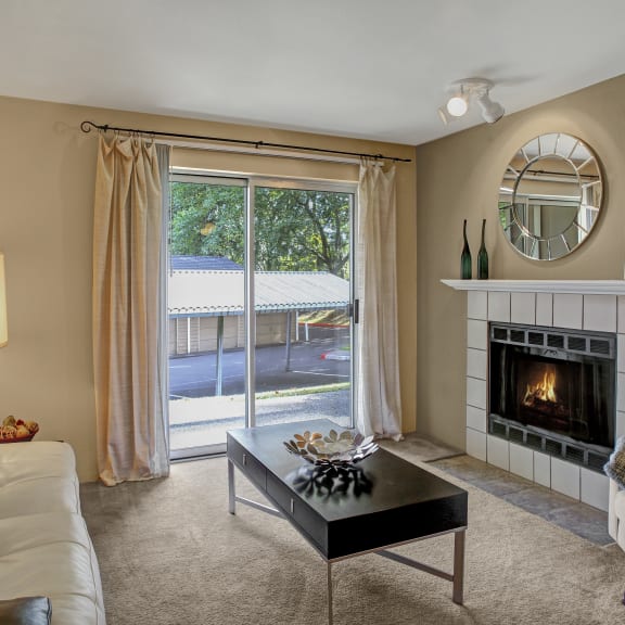 a living room with a fireplace and a couch