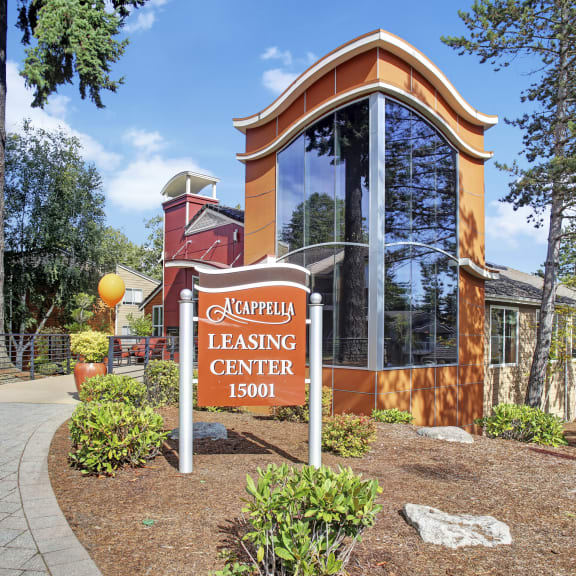 a building with a sign for the campus leasing center