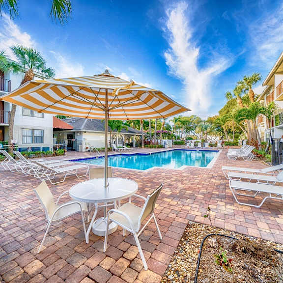 pool with sundecks at bella lago vista, west palm beach