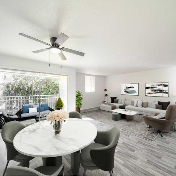a living room with a white ceiling fan and grey chairs. at red bay apartment complex, jacksonville, fl, 32211
