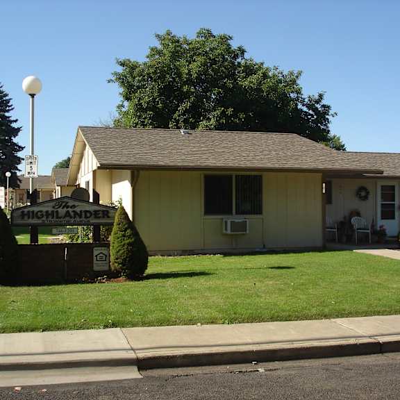 a house with a sign in front of it that says highlander