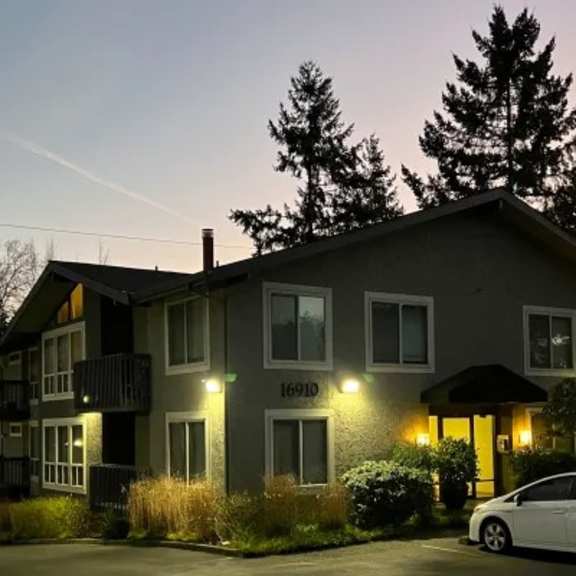 a house with a car parked in front of it