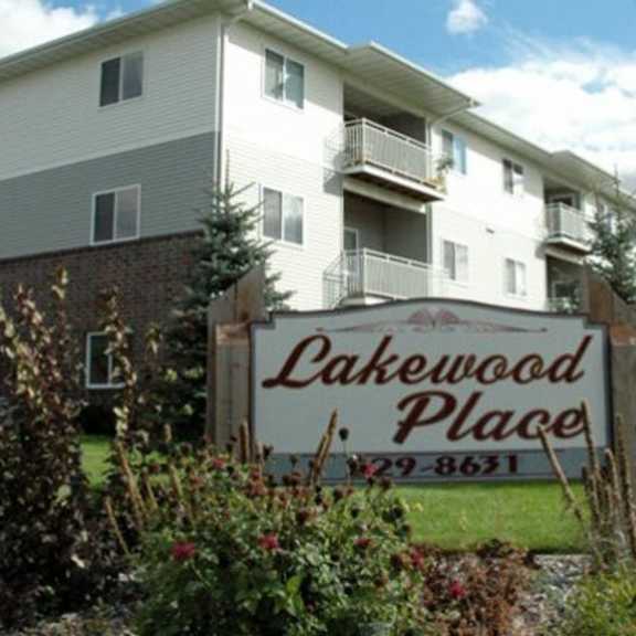 a sign for lakewood place in front of a building.