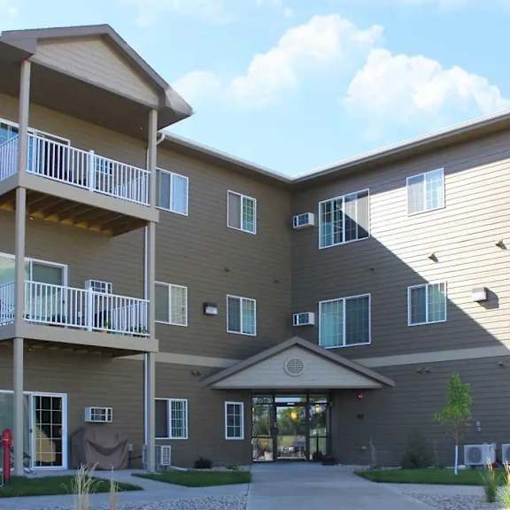 a large apartment complex with a central courtyard and multiple balconies.