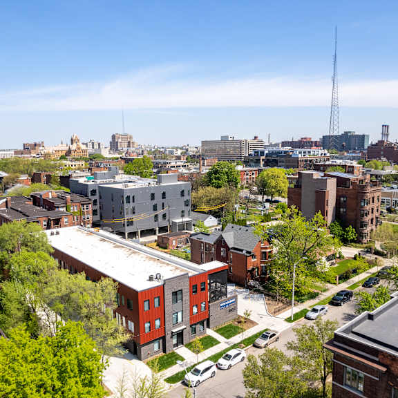 a cityscape with a mix of residential and commercial buildings.