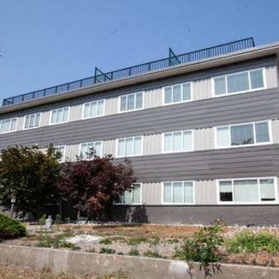 a large building with a balcony on top of it