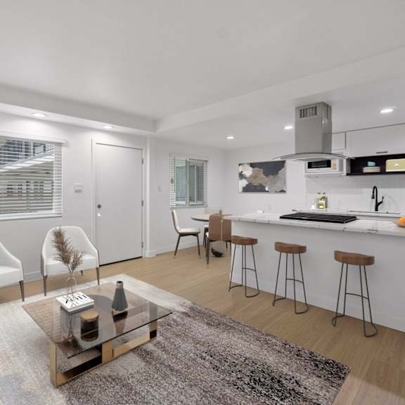a modern kitchen with white cabinets and a bar area.