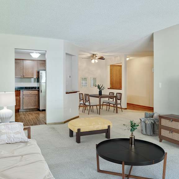 a living room with a couch, coffee table, and television at crosby pointe apartments, minnesota, 55116-3244