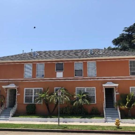 a red brick building with steps in front of it